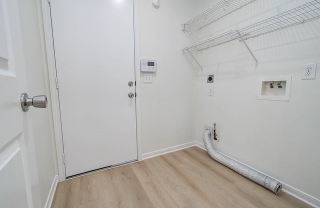 17515 Prospect Meadows Dr, Houston, TX 77095 - laundry area featuring electric dryer hookup, washer hookup, gas dryer hookup, and light wood-type flooring