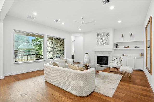 4951 Glenmeadow Dr, Houston, TX 77096 - living area featuring a premium fireplace, wood finished floors, a ceiling fan, and recessed lighting