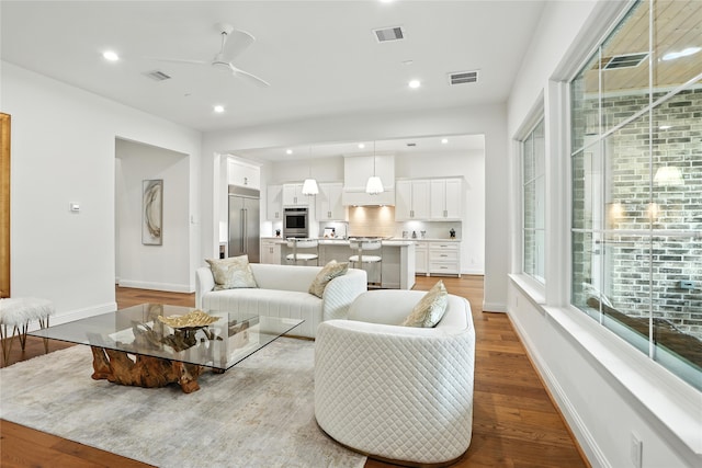4951 Glenmeadow Dr, Houston, TX 77096 - living room featuring a ceiling fan, wood finished floors, and recessed lighting