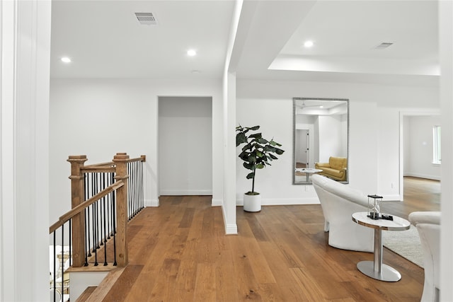 4951 Glenmeadow Dr, Houston, TX 77096 - corridor featuring wood finished floors, recessed lighting, and an upstairs landing