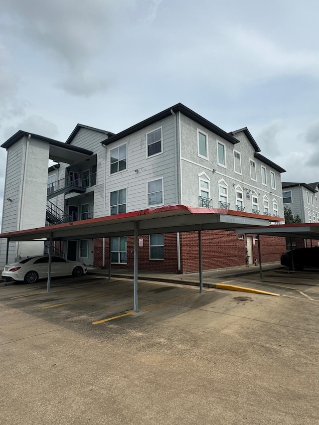 6289 Wilcrest Dr Unit 7300, Houston, TX 77072 - view of property featuring covered parking