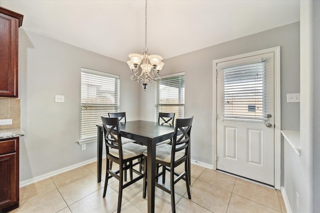 6910 Lamar Park Ln, Houston, TX 77049 - dining space featuring a chandelier and light tile patterned floors