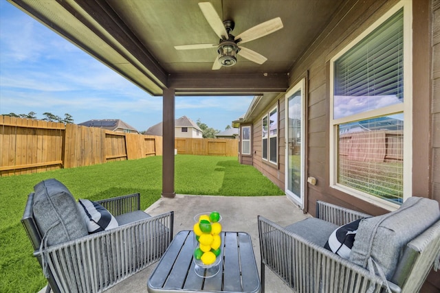 6910 Lamar Park Ln, Houston, TX 77049 - fenced backyard with a patio area, ceiling fan, and outdoor lounge area