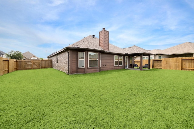 6910 Lamar Park Ln, Houston, TX 77049 - back of house with a chimney, a fenced backyard, and roof with shingles
