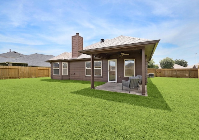 6910 Lamar Park Ln, Houston, TX 77049 - rear view of house with ceiling fan, a fenced backyard, a chimney, and a patio