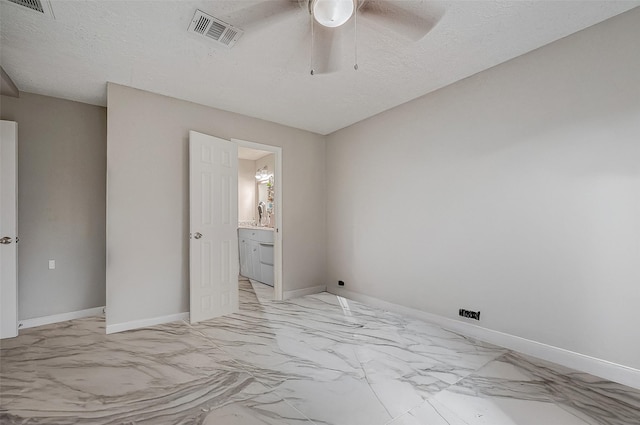 9215 Golden Meadow Dr, Houston, TX 77064 - empty room featuring light marble finish flooring, a ceiling fan, and a textured ceiling
