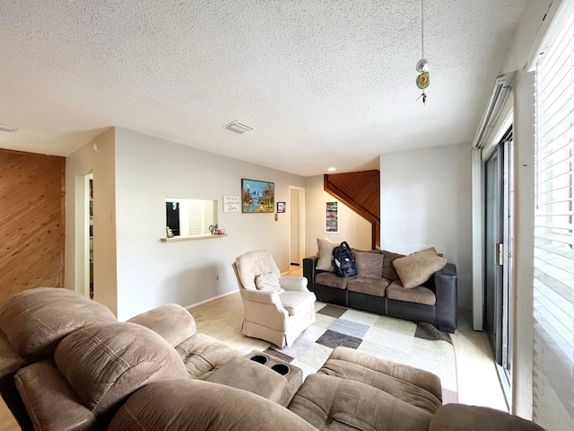 9471 Pagewood Ln Unit 9471, Houston, TX 77063 - living room with a textured ceiling