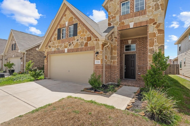 7726 Granite Terrace Ln, Houston, TX 77083 - view of front facade with stone siding, concrete driveway, brick siding, and an attached garage