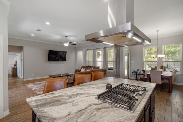 12118 Enclave Ct, Santa Fe, TX 77510 - dining space with a chandelier, wood finished floors, a ceiling fan, ornamental molding, and recessed lighting