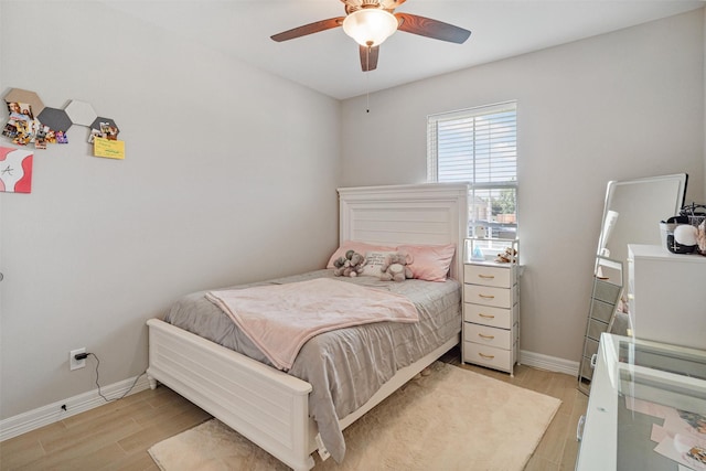 12118 Enclave Ct, Santa Fe, TX 77510 - bedroom with light wood-style floors and ceiling fan