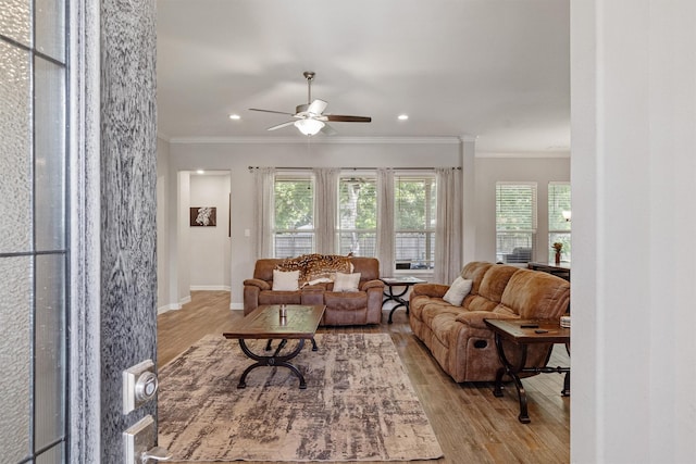 12118 Enclave Ct, Santa Fe, TX 77510 - living area featuring wood finished floors, ceiling fan, healthy amount of natural light, crown molding, and recessed lighting