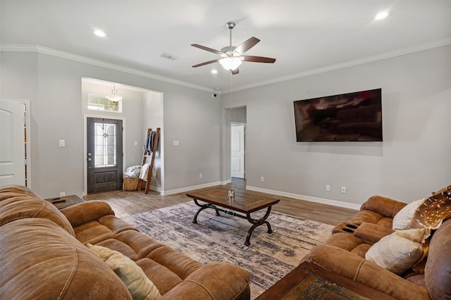 12118 Enclave Ct, Santa Fe, TX 77510 - living area featuring wood finished floors, a ceiling fan, crown molding, and recessed lighting
