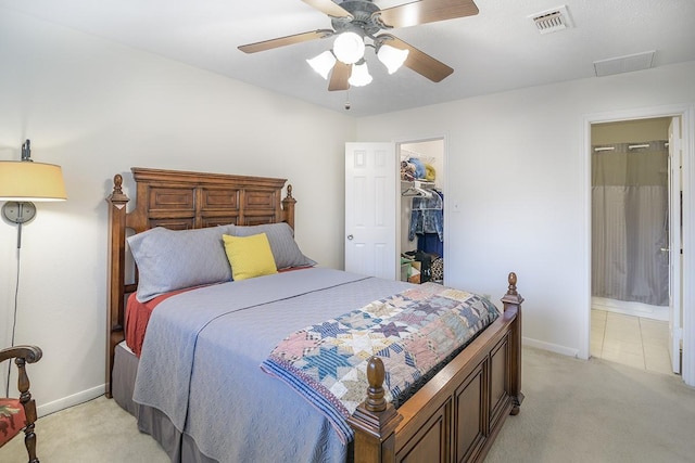 22419 Kent Falls Dr, Katy, TX 77450 - bedroom featuring light colored carpet, ceiling fan, ensuite bath, and a walk in closet
