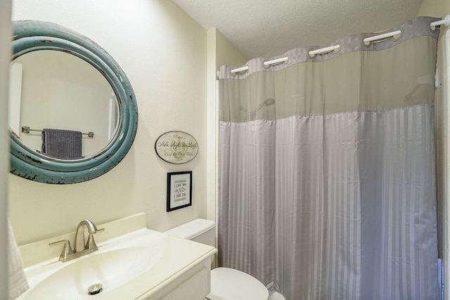 22419 Kent Falls Dr, Katy, TX 77450 - bathroom with a textured ceiling, vanity, and a shower with curtain