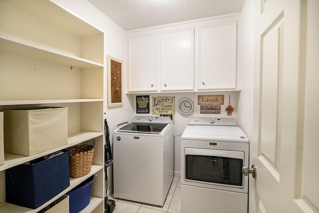 22419 Kent Falls Dr, Katy, TX 77450 - washroom with washer and dryer, cabinet space, and light tile patterned floors