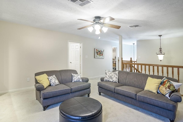 22419 Kent Falls Dr, Katy, TX 77450 - living room featuring light carpet, a ceiling fan, and a textured ceiling
