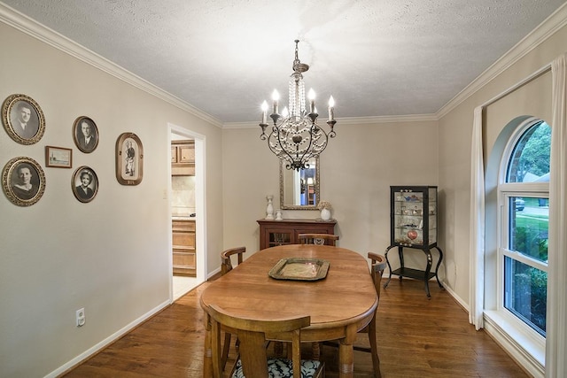 22419 Kent Falls Dr, Katy, TX 77450 - dining area with a chandelier, dark wood-type flooring, ornamental molding, and a textured ceiling