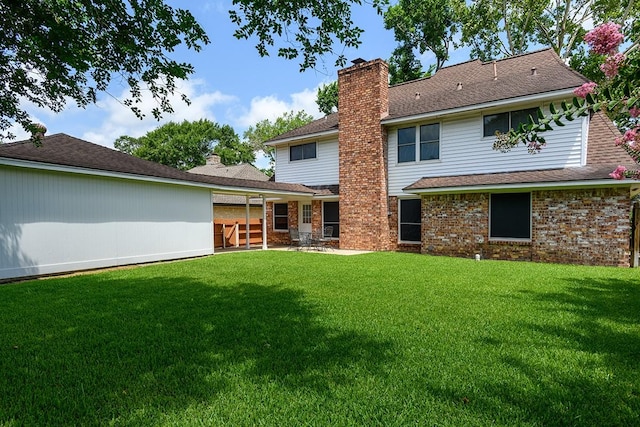 22419 Kent Falls Dr, Katy, TX 77450 - rear view of property featuring a chimney, a lawn, and a shingled roof