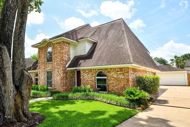22419 Kent Falls Dr, Katy, TX 77450 - traditional home featuring brick siding, a front yard, a garage, and a shingled roof