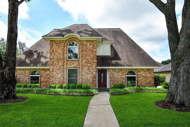 22419 Kent Falls Dr, Katy, TX 77450 - view of front of home featuring a front lawn, brick siding, and roof with shingles
