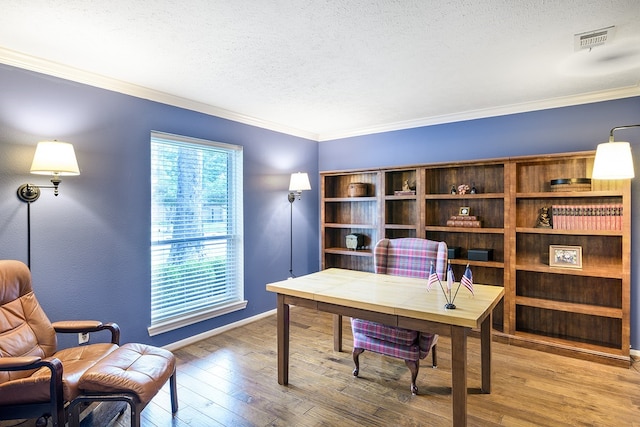22419 Kent Falls Dr, Katy, TX 77450 - home office with a textured ceiling, wood finished floors, and crown molding