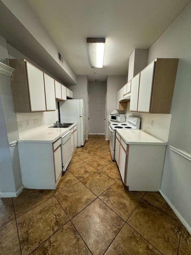 6289 Wilcrest Dr Unit 7101, Houston, TX 77072 - kitchen featuring white appliances, light countertops, and white cabinets