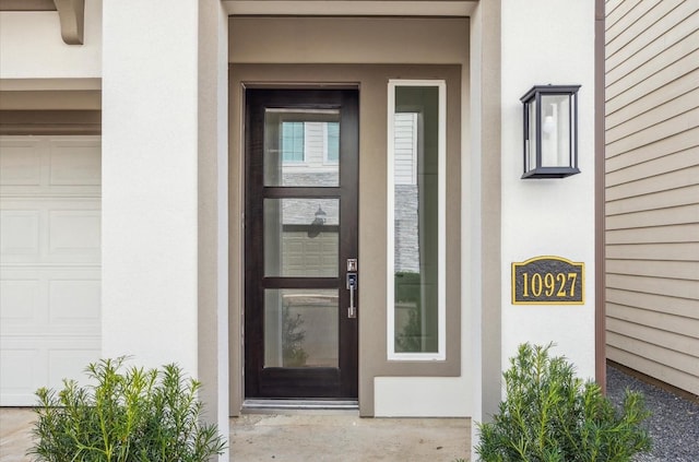 10927 Brookeshire Chase Ln, Houston, TX 77043 - property entrance with stucco siding and a garage