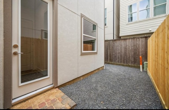 10927 Brookeshire Chase Ln, Houston, TX 77043 - view of exterior entry with a patio area