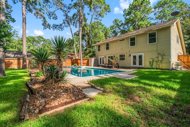 6 Fairmeade Bend Dr, The Woodlands, TX 77381 - view of pool with french doors and a fenced backyard