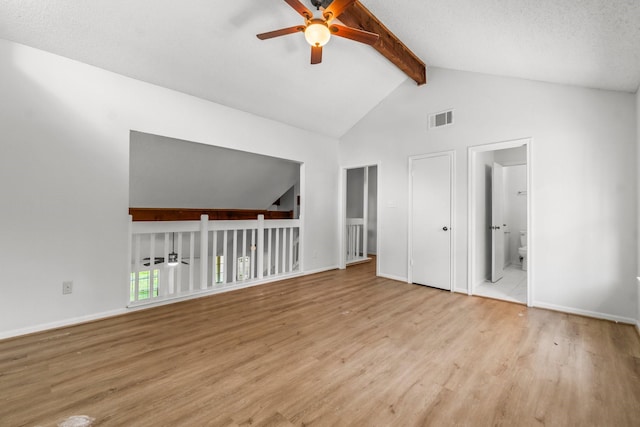 6 Fairmeade Bend Dr, The Woodlands, TX 77381 - empty room with a ceiling fan, beamed ceiling, wood finished floors, and high vaulted ceiling