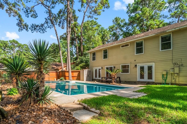 6 Fairmeade Bend Dr, The Woodlands, TX 77381 - view of swimming pool featuring french doors, a fenced backyard, and a patio area