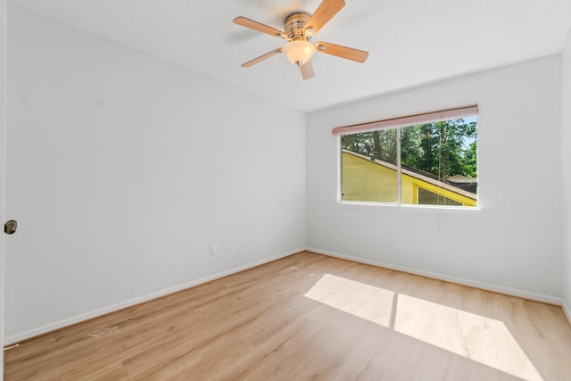 6 Fairmeade Bend Dr, The Woodlands, TX 77381 - unfurnished room with wood finished floors and a ceiling fan