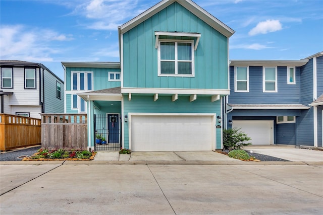 2507 Bay Breeze Dr, Kemah, TX 77565 - view of front facade with board and batten siding, driveway, and an attached garage