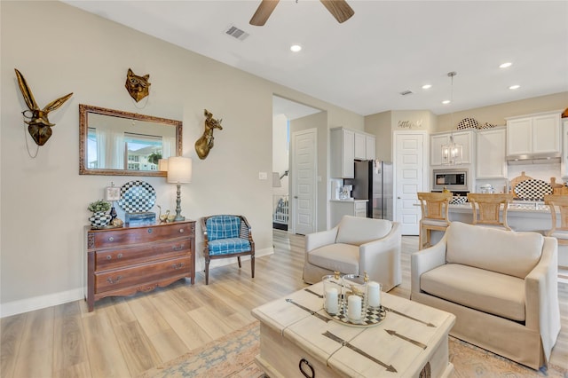 2507 Bay Breeze Dr, Kemah, TX 77565 - living area with light wood-style flooring, a ceiling fan, and recessed lighting