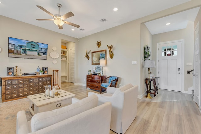 2507 Bay Breeze Dr, Kemah, TX 77565 - living room with a ceiling fan, light wood-style flooring, and recessed lighting