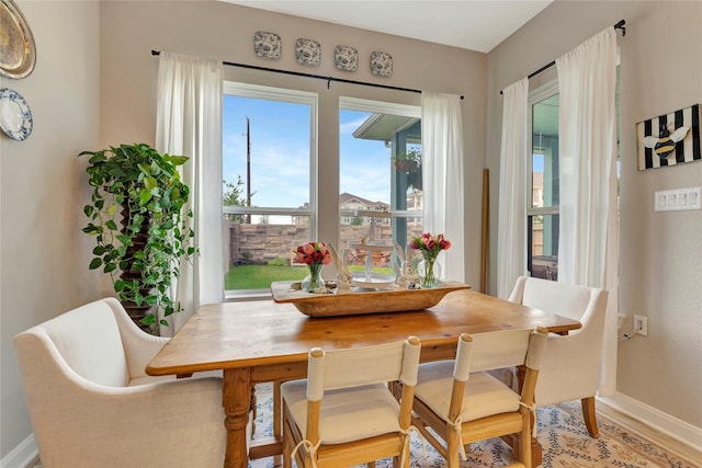 2507 Bay Breeze Dr, Kemah, TX 77565 - dining room featuring baseboards and light wood-style floors