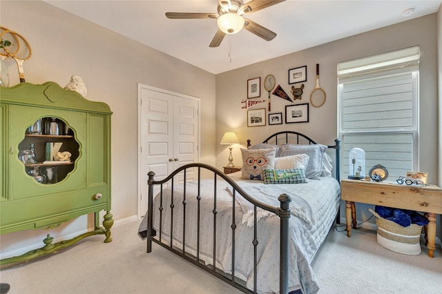 2507 Bay Breeze Dr, Kemah, TX 77565 - bedroom with light colored carpet and a ceiling fan