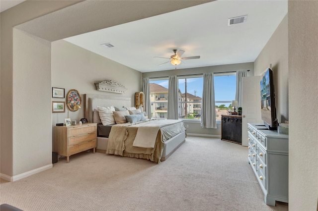 2507 Bay Breeze Dr, Kemah, TX 77565 - bedroom with light colored carpet and ceiling fan