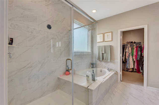 2507 Bay Breeze Dr, Kemah, TX 77565 - full bathroom with a bath, a marble finish shower, a spacious closet, and marble look tile flooring