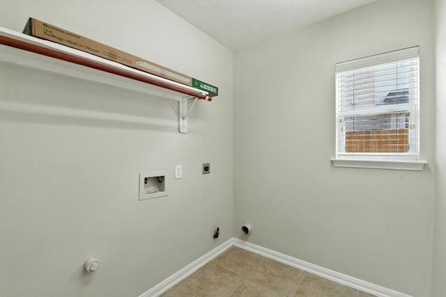 6538 Ivy Heath Ln, Houston, TX 77041 - laundry area featuring washer hookup, hookup for an electric dryer, light tile patterned flooring, gas dryer hookup, and healthy amount of natural light