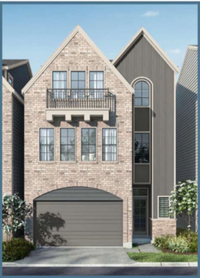 8707 Padua Ln, Houston, TX 77055 - view of front of home featuring a balcony, an attached garage, concrete driveway, and brick siding