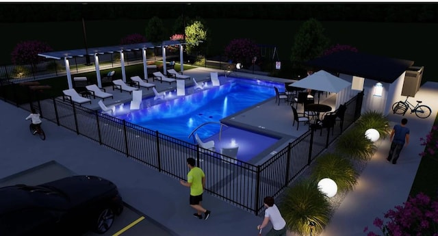 8707 Padua Ln, Houston, TX 77055 - pool at night featuring a community pool and a patio