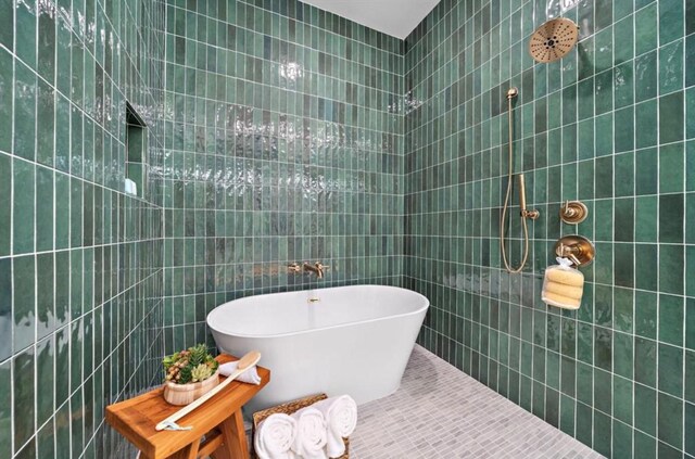 8707 Padua Ln, Houston, TX 77055 - full bath featuring tile walls, a tile shower, and a freestanding tub