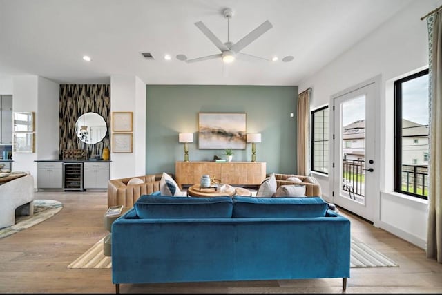 8707 Padua Ln, Houston, TX 77055 - living area with beverage cooler, light wood-style floors, ceiling fan, and recessed lighting