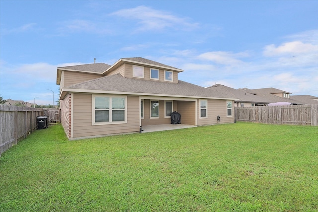 18519 Orono Ridge Trl, Richmond, TX 77407 - back of property with a patio, a fenced backyard, and roof with shingles
