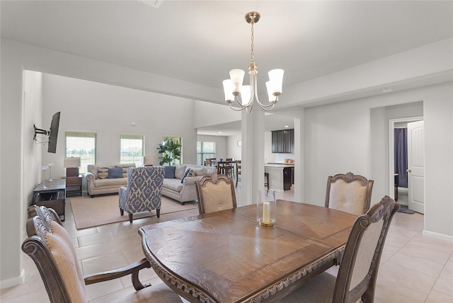 18519 Orono Ridge Trl, Richmond, TX 77407 - dining space with light tile patterned floors and a chandelier