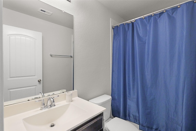 18519 Orono Ridge Trl, Richmond, TX 77407 - bathroom featuring toilet and vanity