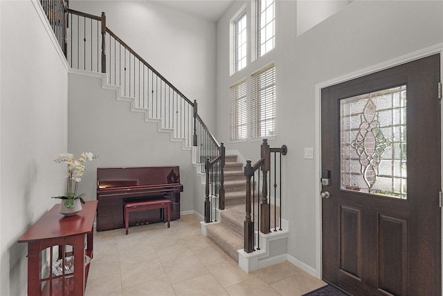 18519 Orono Ridge Trl, Richmond, TX 77407 - entryway with a high ceiling, stairs, and light tile patterned flooring