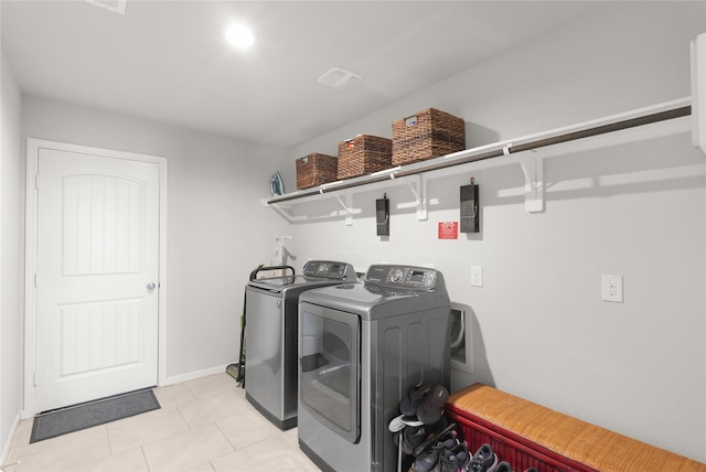 18519 Orono Ridge Trl, Richmond, TX 77407 - laundry room with independent washer and dryer and light tile patterned floors