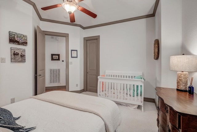 4216 Karankawa Way, Jamaica Beach, TX 77554 - bedroom featuring ornamental molding, a ceiling fan, and carpet floors